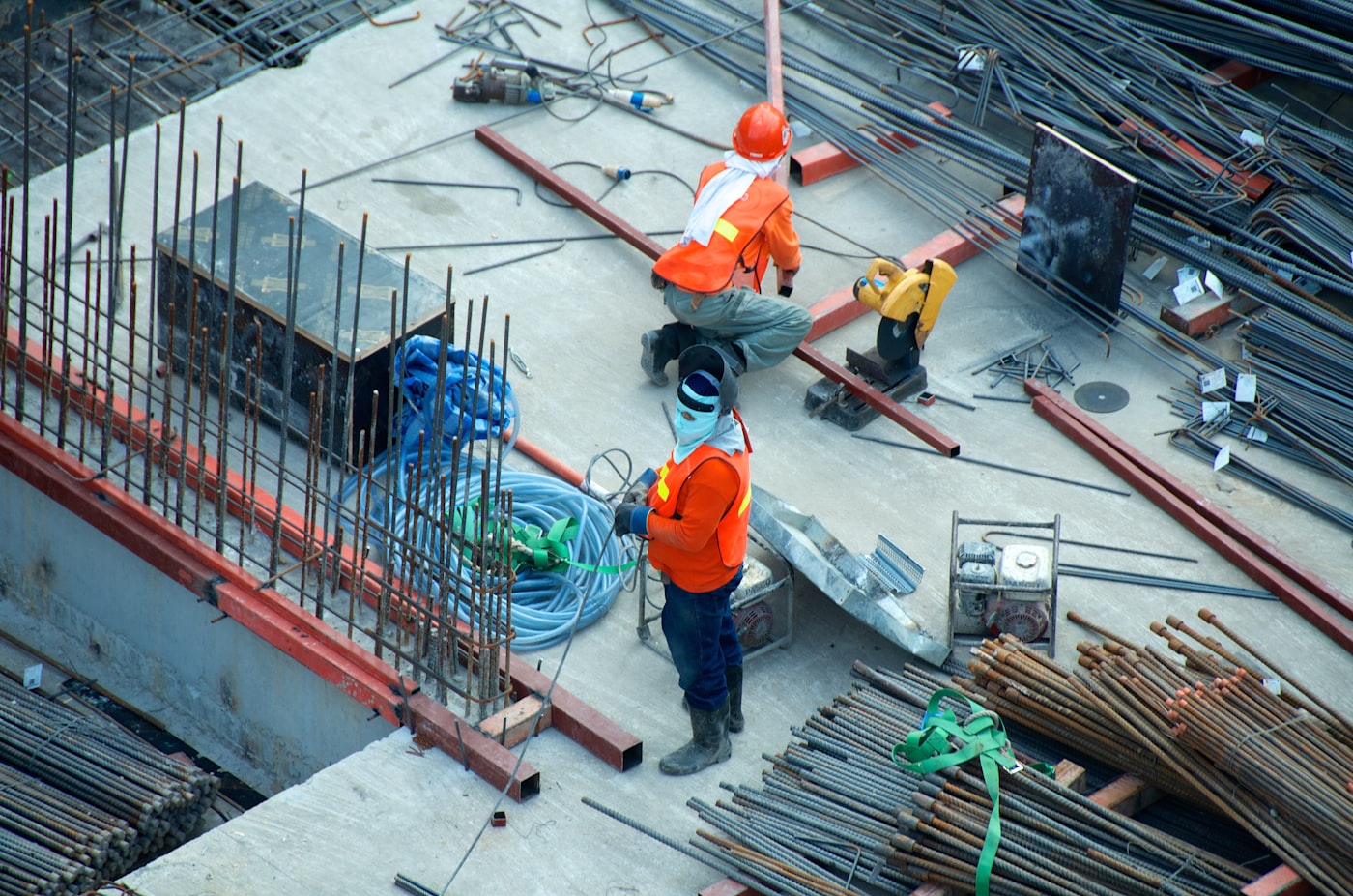 Construction material delivery trucks moving through a site access route